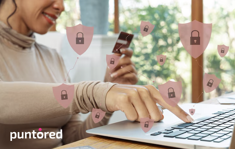 Mujer realizando una transacción digital rodeada de íconos de escudos, ilustrando la confianza y seguridad de datos con Puntored.